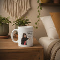 White mug with a graphic of a person and text on a white background